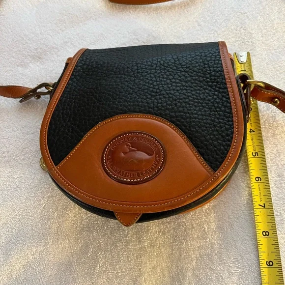 Dooney & Bourke All Weather Leather Black & Tan Saddle Crossbody Bag. - Picture 8 of 9